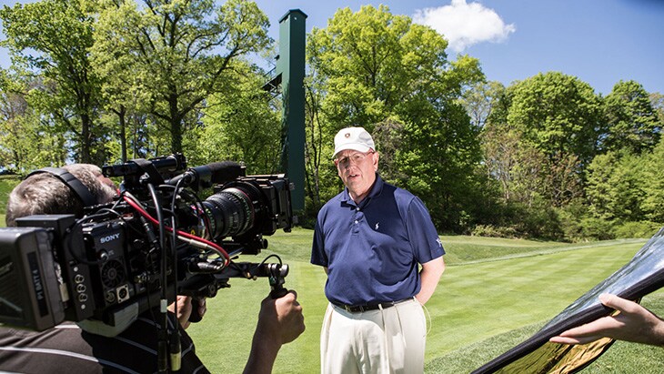 The elevator transports golfers from the 17th...
