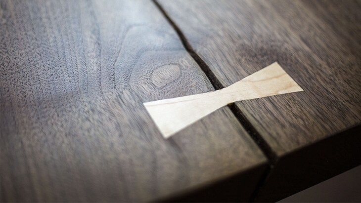 This wooden bow-tie key not only serves as a...