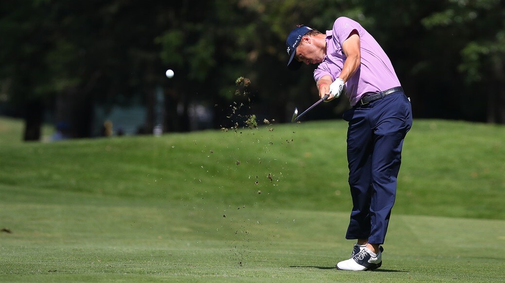 Golfer Swinging on fairway